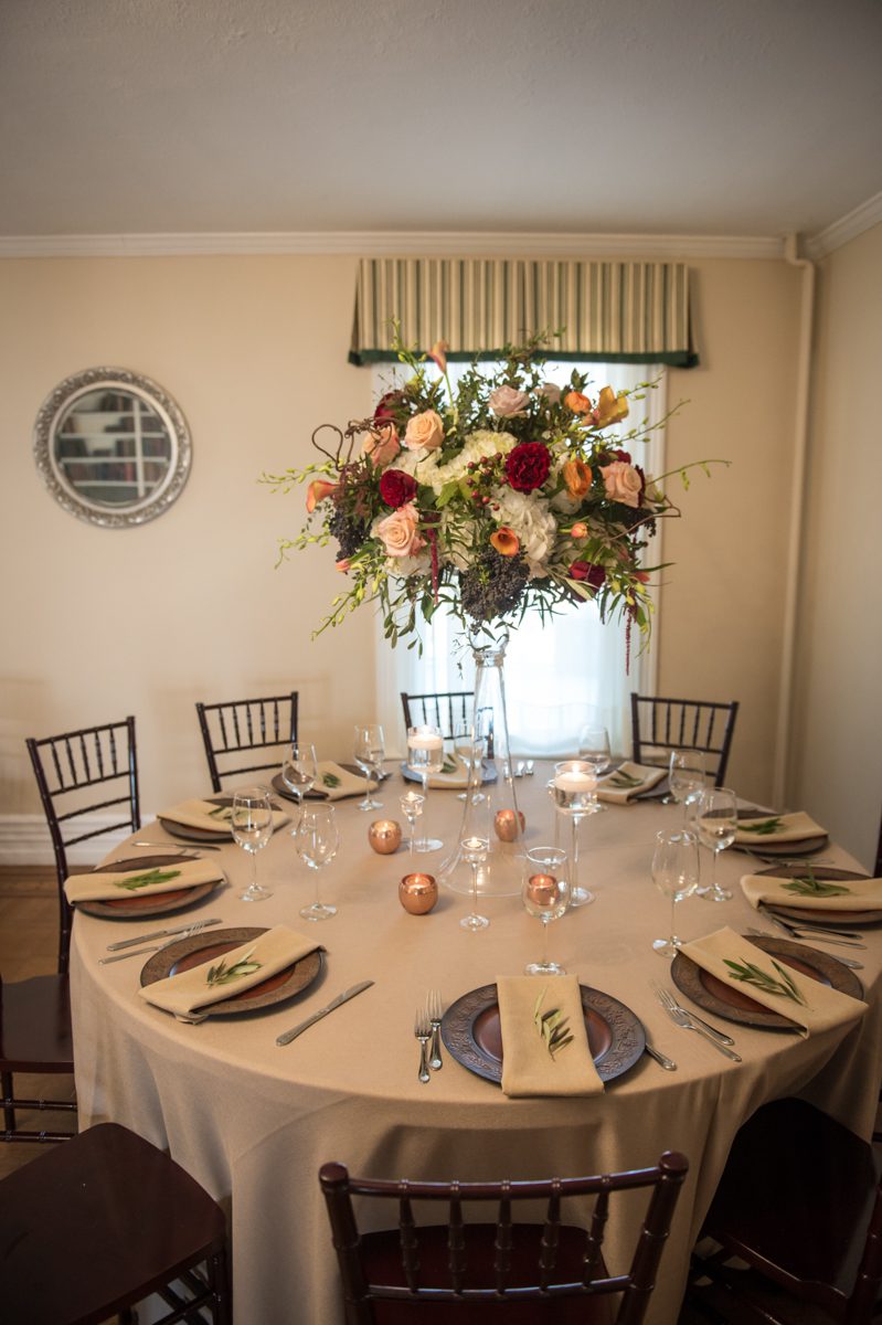 Weddings at Tarrywile Light brown linen accented with chocolate charger plates